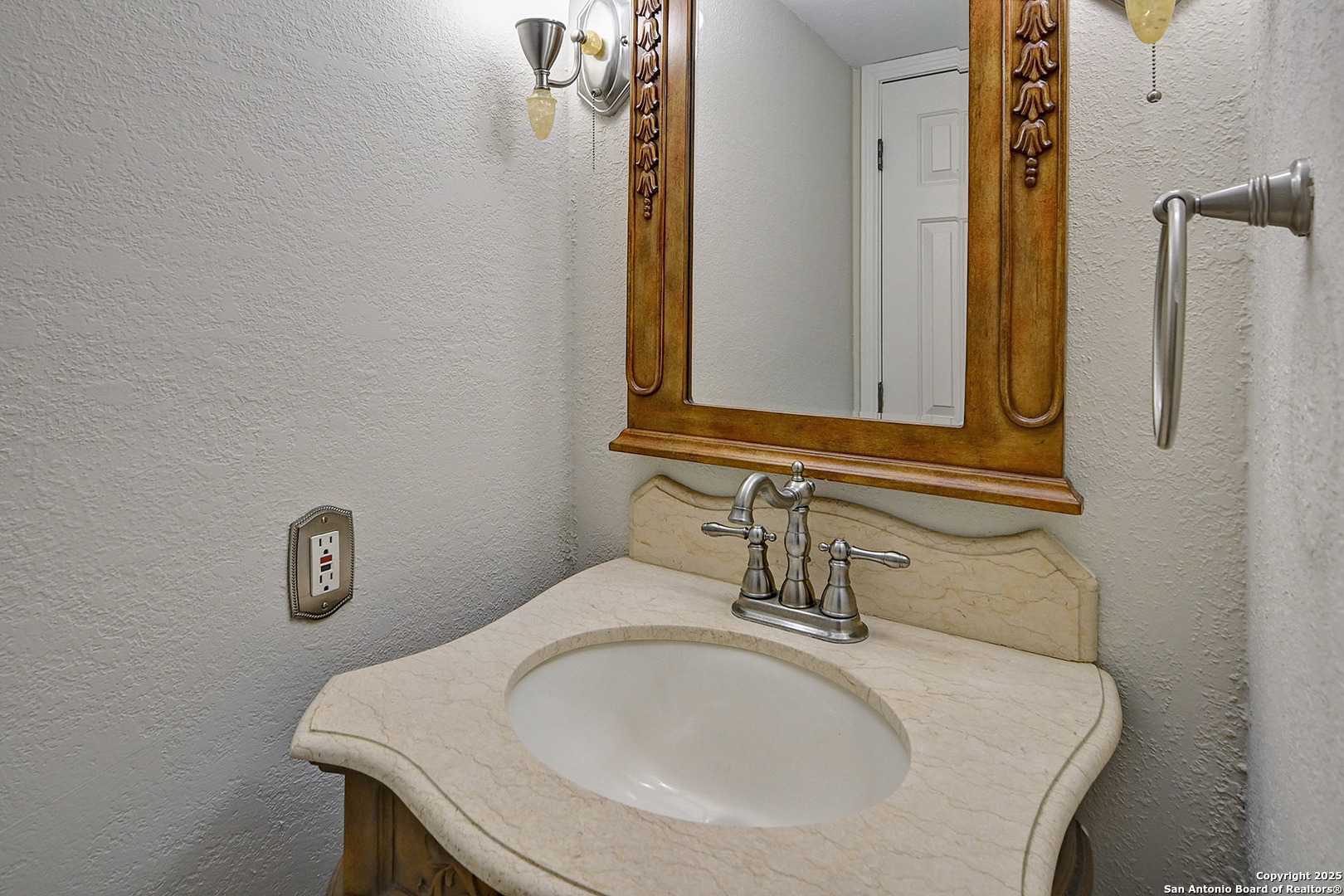 7543 Beaver Tree San Antonio, TX 78249 - Photo 22 of 38 a bathroom with a sink and a mirror