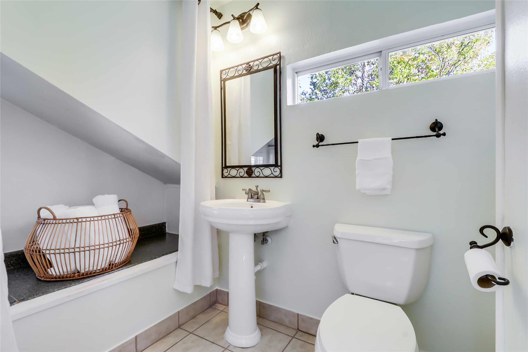 1105 West 43rd Street Austin, TX 78756 - Photo 18 of 22 a bathroom with a sink mirror and toilet