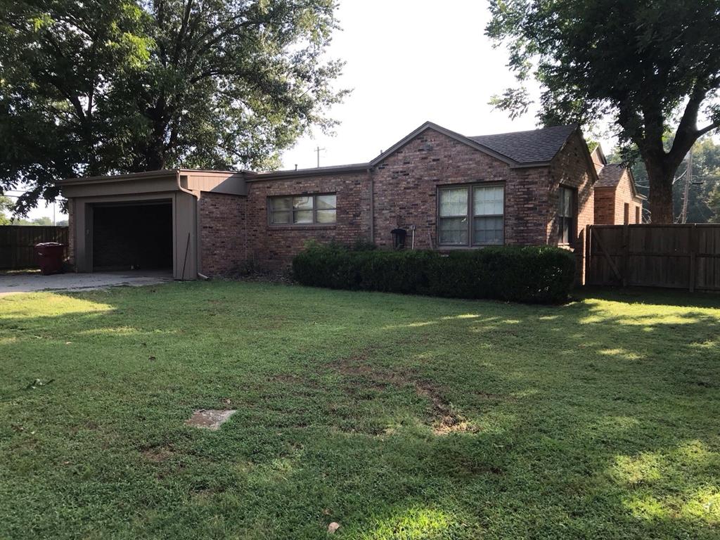 1824 North Binkley Street Sherman, TX 75092 - Photo 17 of 19 Single story home featuring an attached garage and brick siding