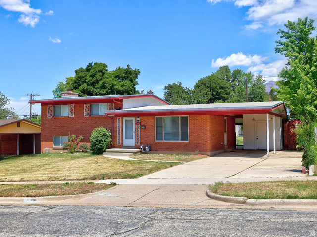 1272 Cook Street Ogden, UT 84404 - Photo 2 of 58 Brick exterior with an integrated carport and a separate detached carport