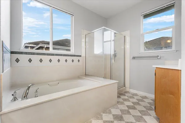 a bathroom with a bathtub and a sink