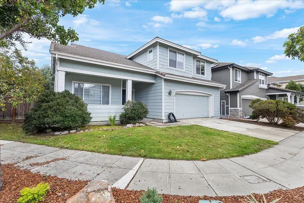 a front view of a house with a yard