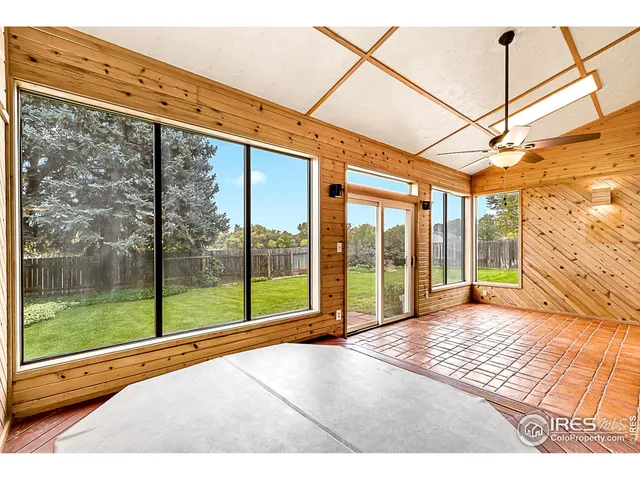 a bed room with a bed and a chandelier