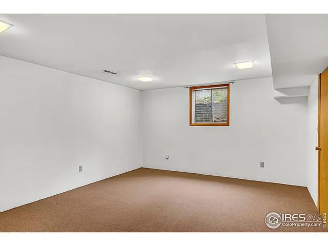 a view of a big yard with a house in the background