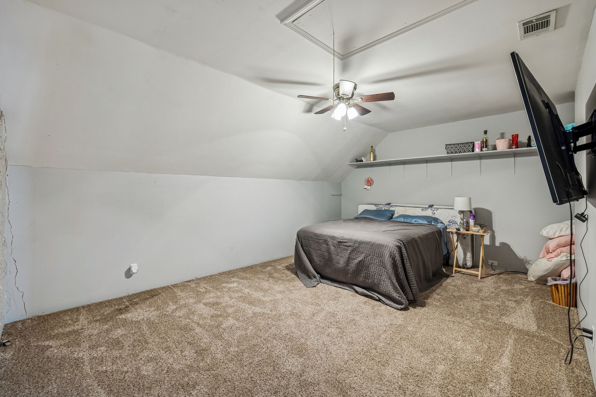 117 Sam Davis Drive Springfield, TN 37172 - Photo 31 of 44 a spacious bedroom with a bed and a chandelier