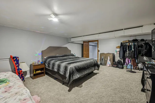 a bedroom with a bed and closet