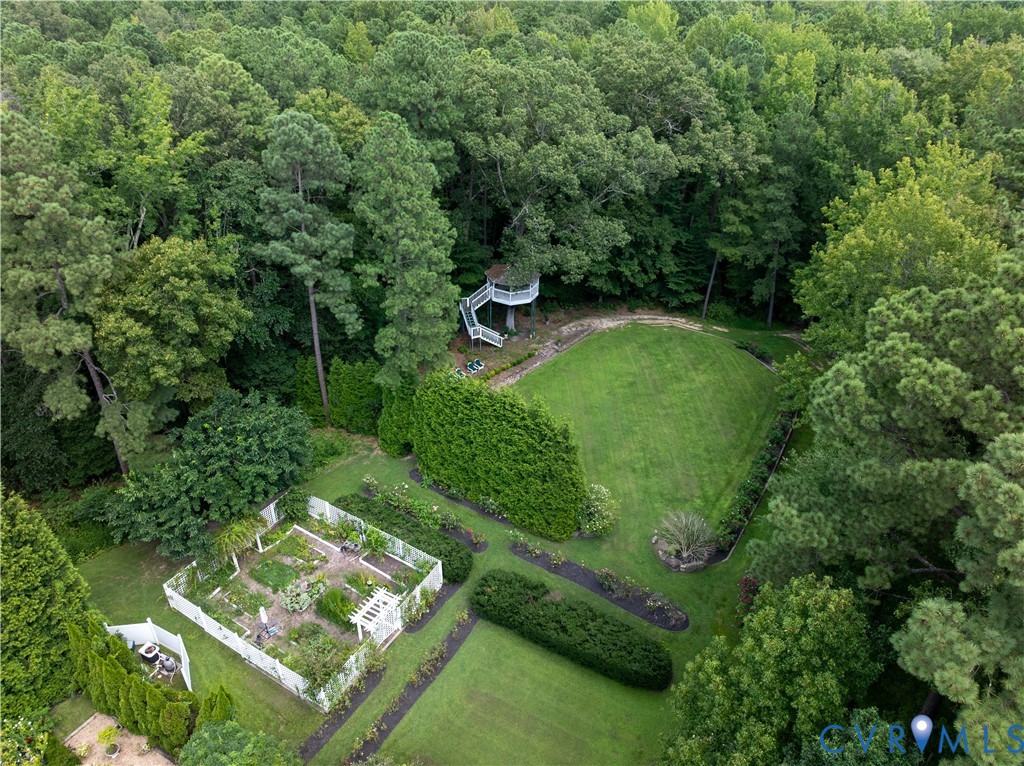 12778 Mt Hermon Road Ashland, VA 23005 - Photo 23 of 50 a view of a garden with a bench