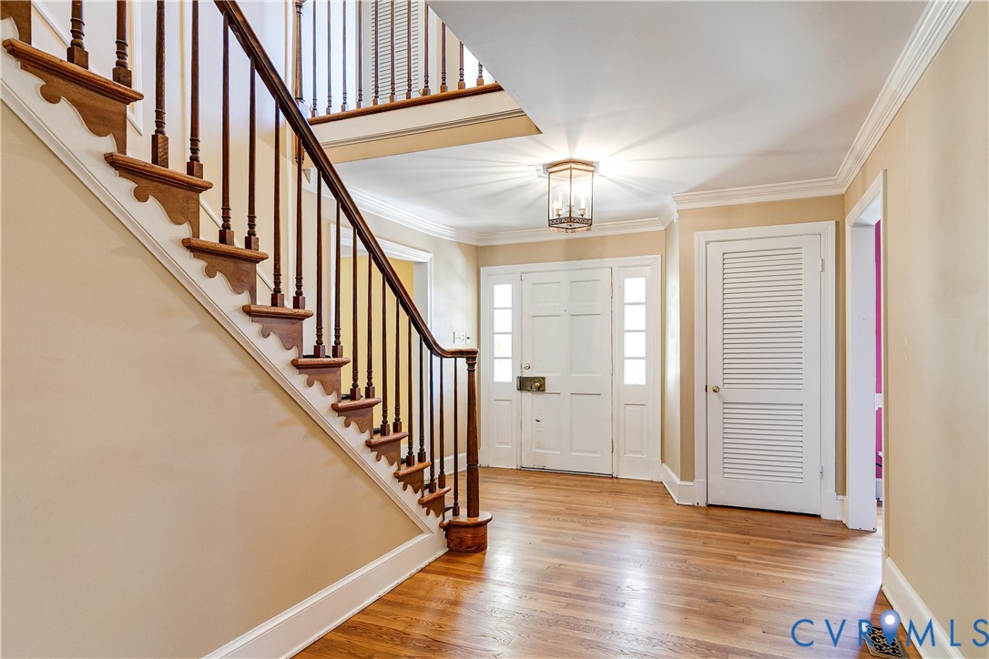12778 Mt Hermon Road Ashland, VA 23005 - Photo 28 of 50 a view of staircase with lots of frames and wooden floor