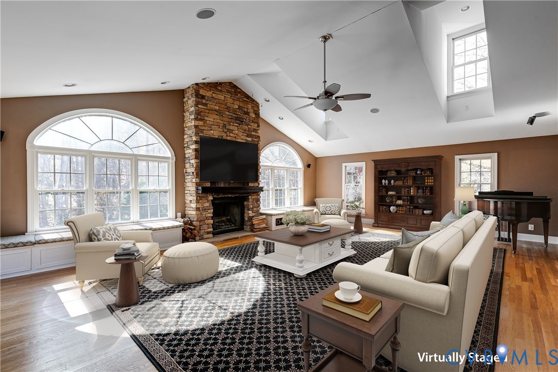 12778 Mt Hermon Road Ashland, VA 23005 - Photo 29 of 50 a living room with furniture a fireplace and a chandelier