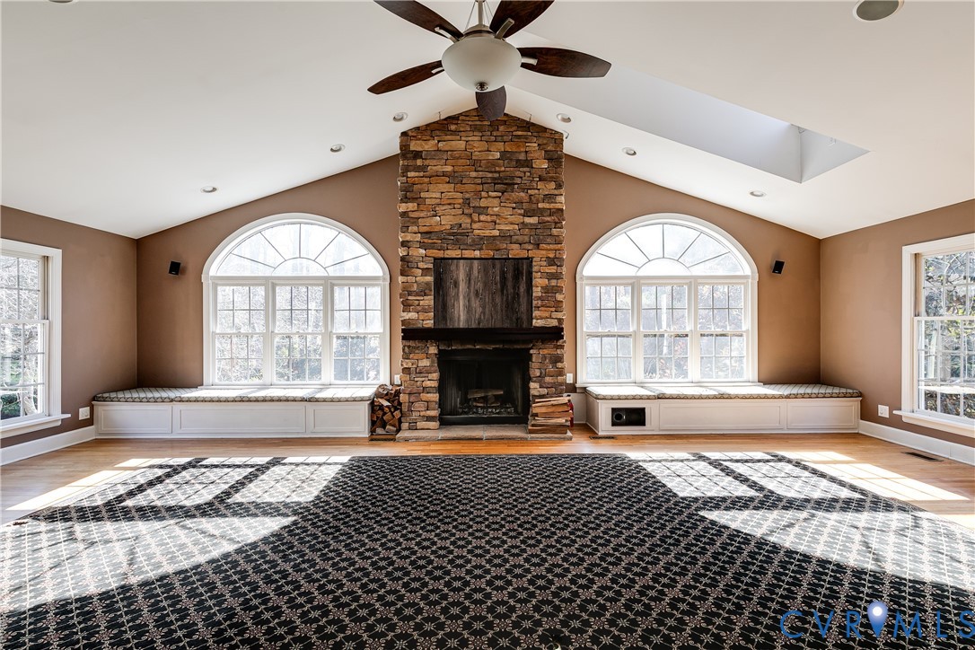 12778 Mt Hermon Road Ashland, VA 23005 - Photo 30 of 50 a view of an empty room with wooden floor and a fireplace