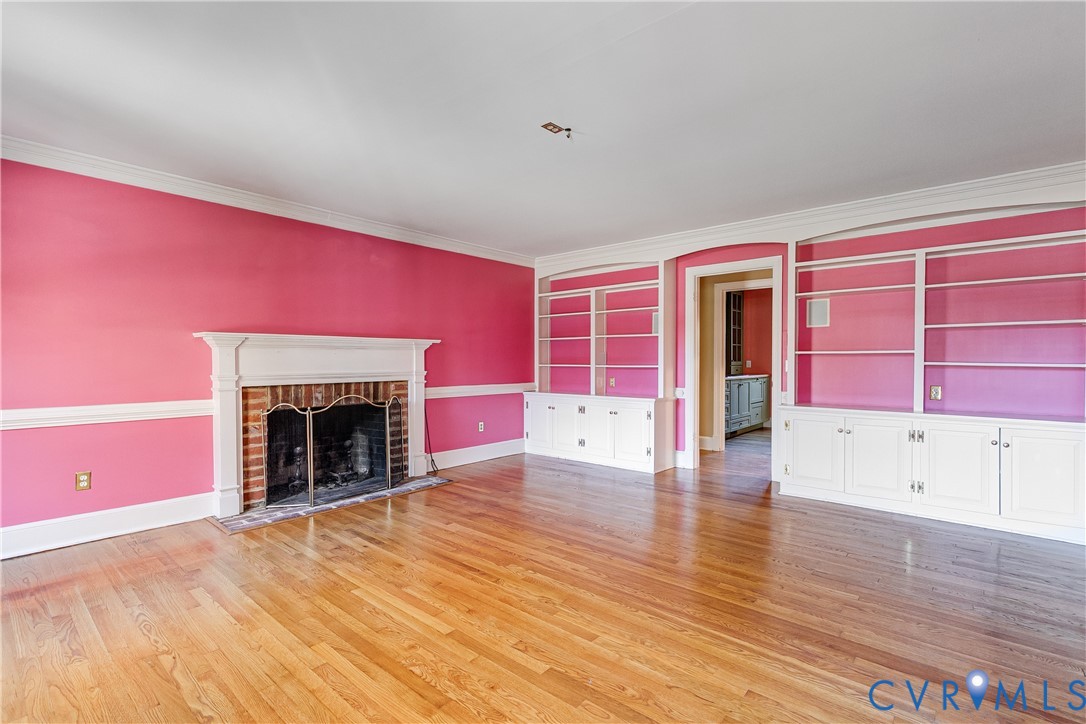 12778 Mt Hermon Road Ashland, VA 23005 - Photo 35 of 50 a view of empty room with wooden floor and fireplace