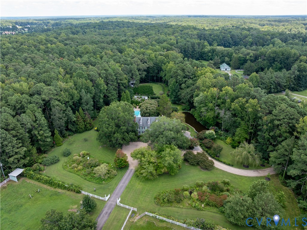 12778 Mt Hermon Road Ashland, VA 23005 - Photo 4 of 50 an aerial view of green landscape with trees houses and mountain view