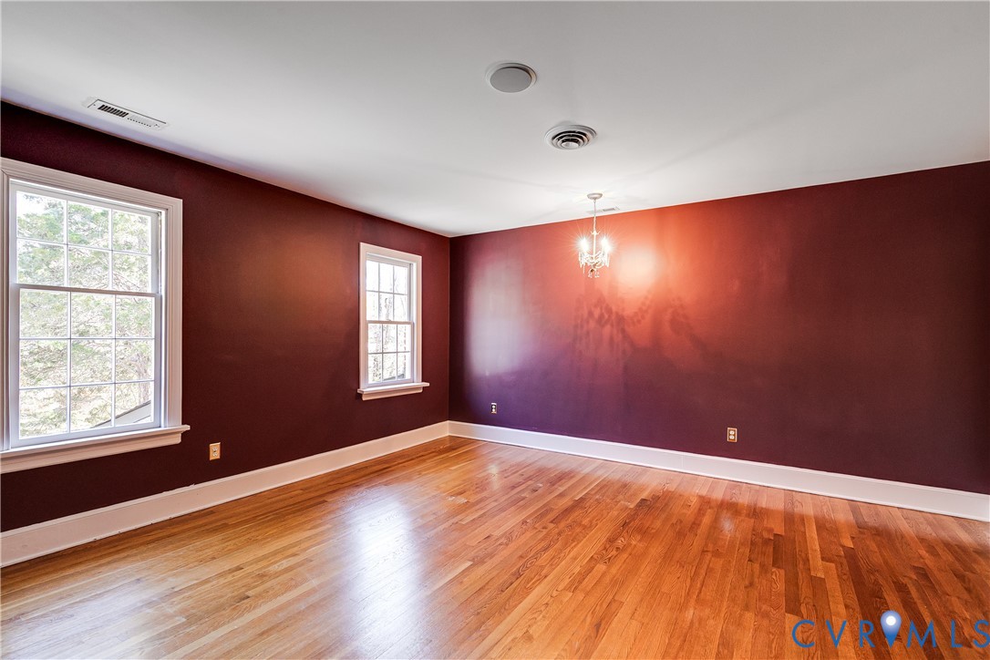 12778 Mt Hermon Road Ashland, VA 23005 - Photo 42 of 50 an empty room with wooden floor and windows