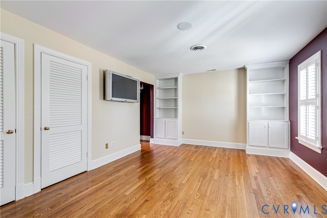 12778 Mt Hermon Road Ashland, VA 23005 - Photo 44 of 50 an empty room with wooden floor and windows