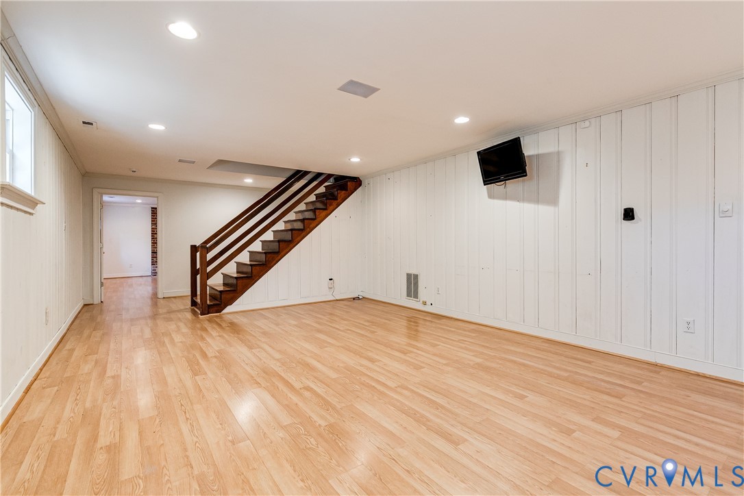 12778 Mt Hermon Road Ashland, VA 23005 - Photo 49 of 50 a view of an empty room with wooden floor and stairs