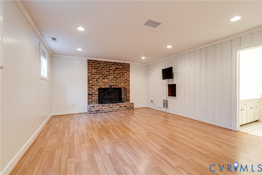 12778 Mt Hermon Road Ashland, VA 23005 - Photo 50 of 50 a view of an empty room with wooden floor fireplace and a window