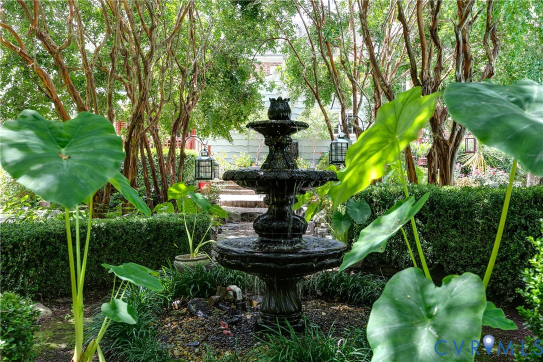 12778 Mt Hermon Road Ashland, VA 23005 - Photo 9 of 50 a view of a fountain in a yard with plants and large trees