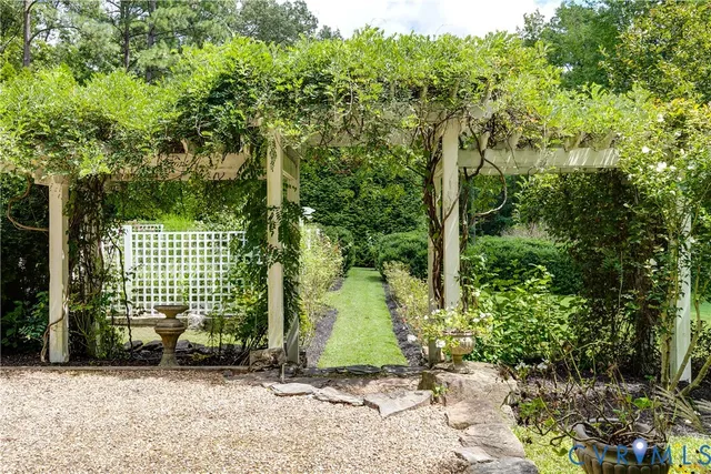 a aerial view of a house with swimming pool and a yard