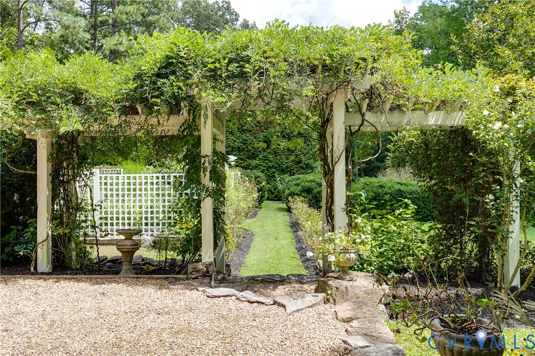 12778 Mt Hermon Road Ashland, VA 23005 - Photo 10 of 50 a view of a garden with plants and large trees