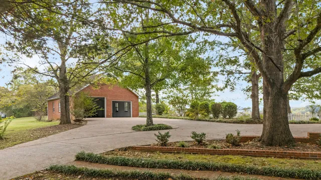 a living room with fireplace furniture and a flat screen tv
