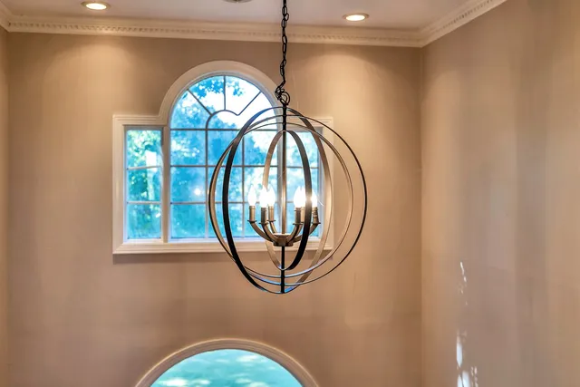 a bathroom with a sink a mirror a shower and a bathtub