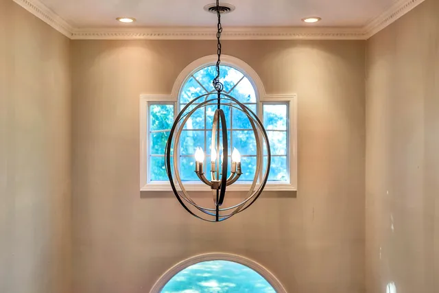 a view of a bedroom with furniture window and wooden floor
