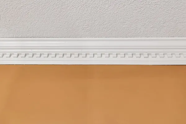 a bedroom with a bed and a lamp on table