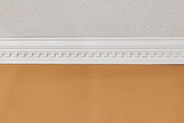 a bedroom with a bed and a lamp on table