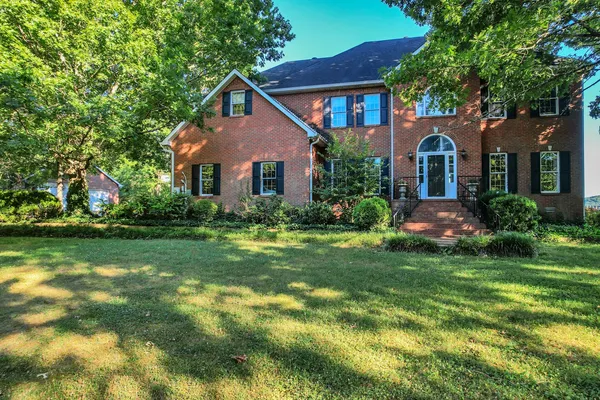 a living room with furniture flat screen tv and a fireplace