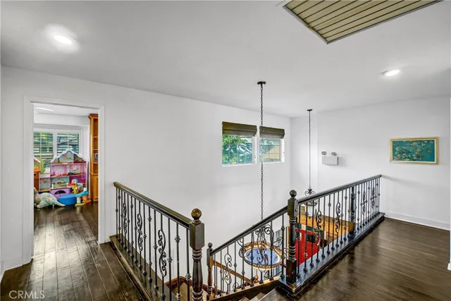 a view of an entryway wooden floor and stairs