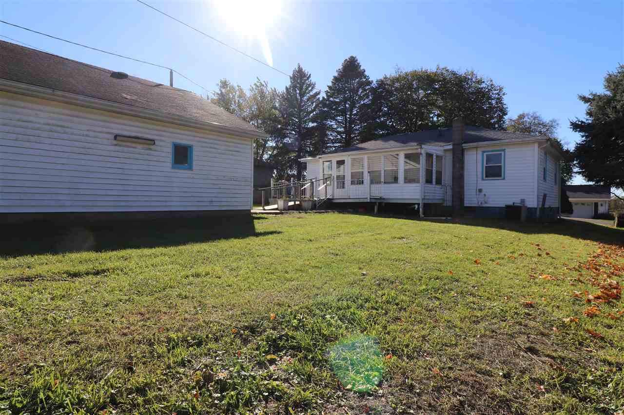 307 Jefferson Street Ridott, IL 61067 - Photo 14 of 16 a view of a yard in front of a house with large tree