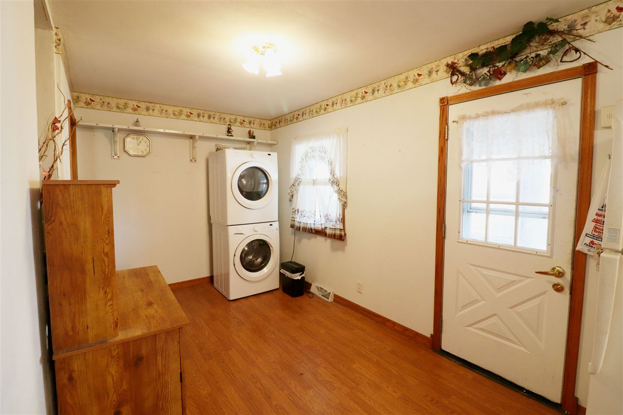 307 Jefferson Street Ridott, IL 61067 - Photo 3 of 16 a view of a storage and utility room with washer and dryer
