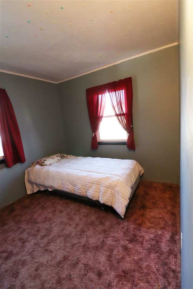 307 Jefferson Street Ridott, IL 61067 - Photo 7 of 16 a bedroom with a bed and a window