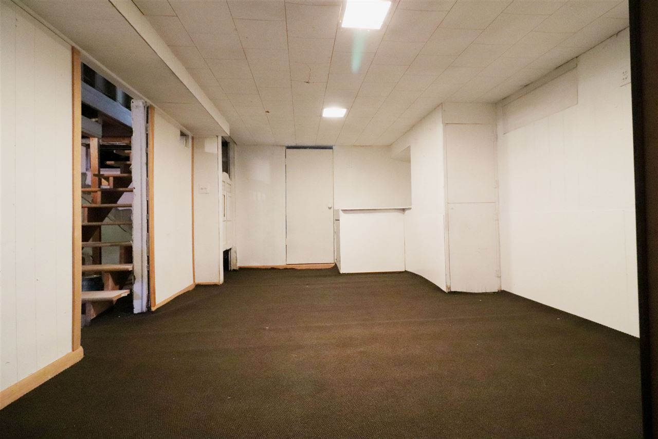 307 Jefferson Street Ridott, IL 61067 - Photo 9 of 16 an empty room with windows