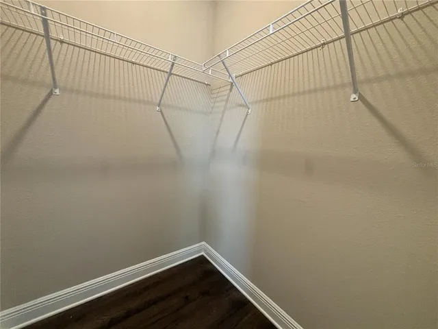 a view of a room with racks on the wall