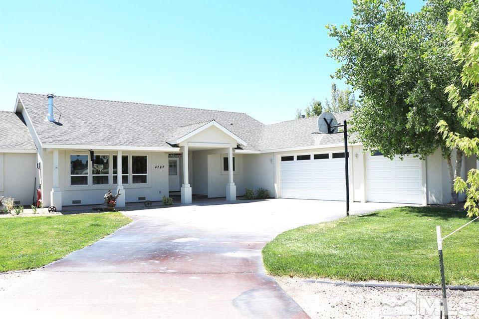 4767 Rancheria Road Fallon, NV 89406 - Photo 1 of 25 a front view of a house with a yard and garage