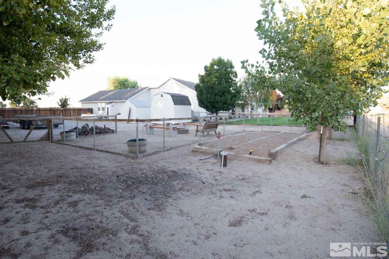 4767 Rancheria Road Fallon, NV 89406 - Photo 24 of 25 a view of a barn in the middle of a yard