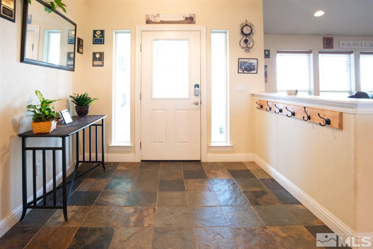 4767 Rancheria Road Fallon, NV 89406 - Photo 5 of 25 a view of hallway with window and wooden floor
