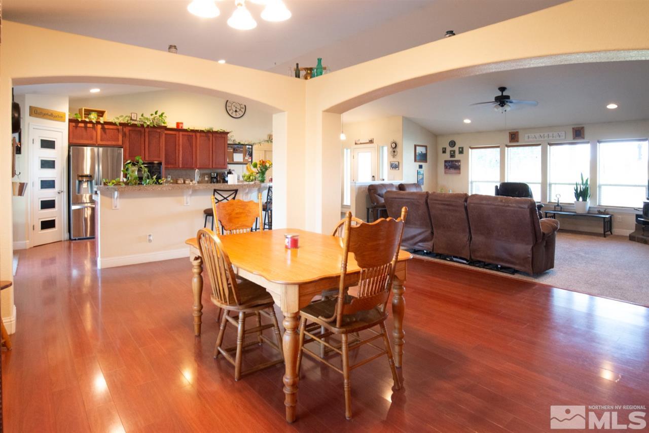 4767 Rancheria Road Fallon, NV 89406 - Photo 10 of 25 a view of a dining room with furniture and wooden floor