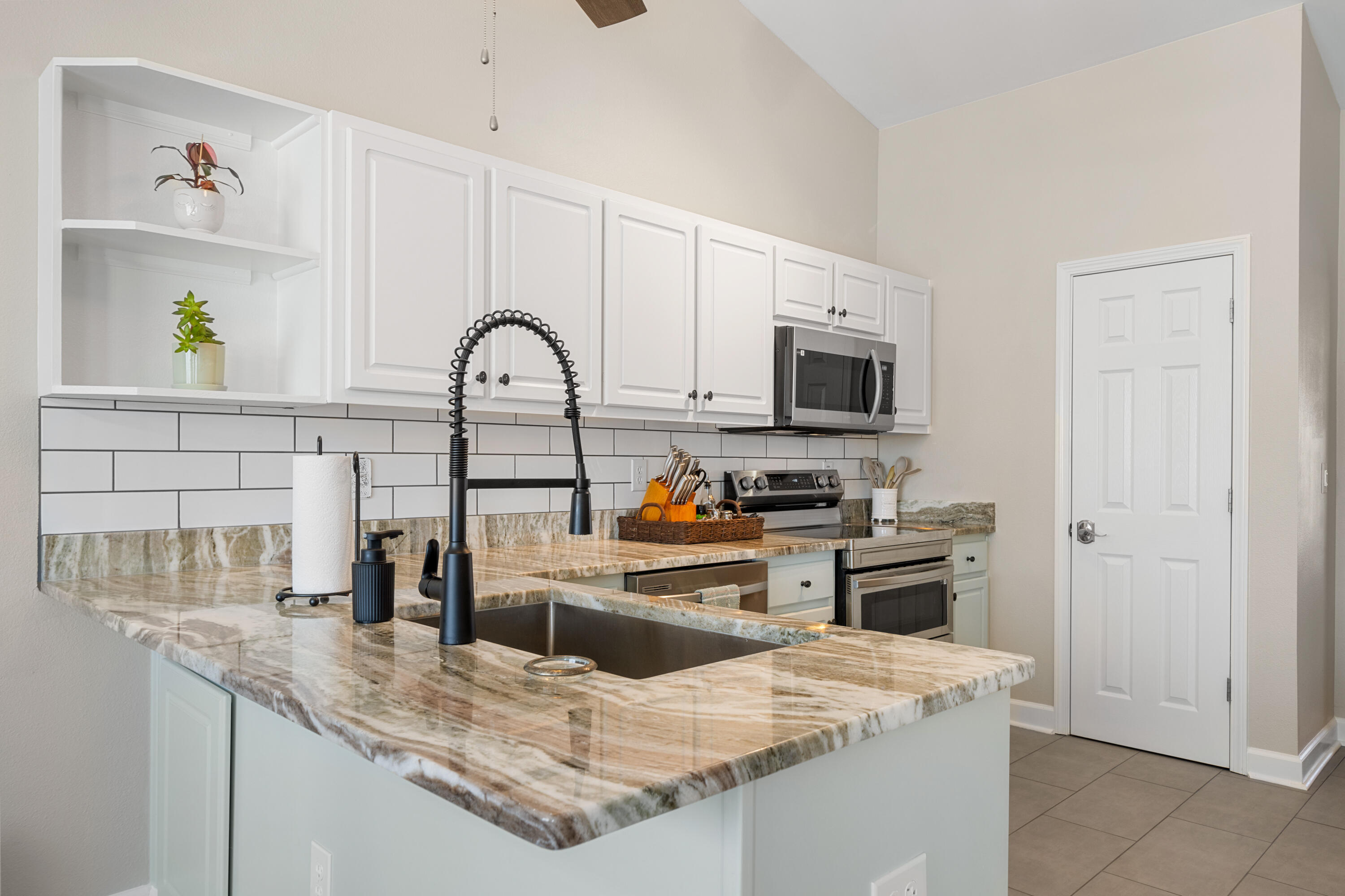 1933 Eagle Lane Navarre, FL 32566 - Photo 15 of 40 a kitchen with stainless steel appliances granite countertop a sink stove and refrigerator