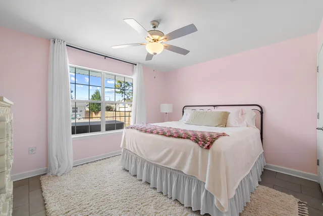 a bedroom with a bed and window