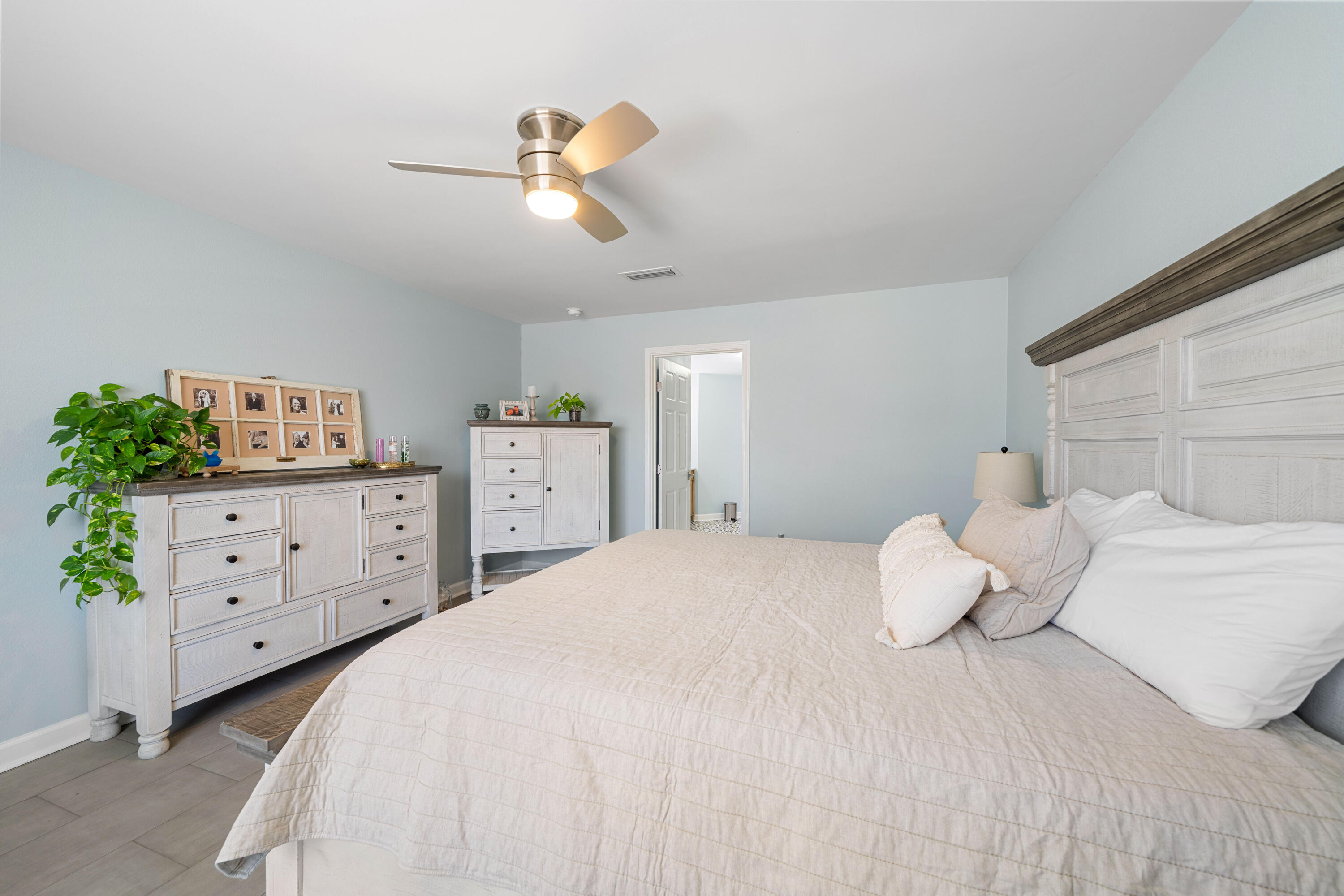 1933 Eagle Lane Navarre, FL 32566 - Photo 27 of 40 a bedroom with a bed and window