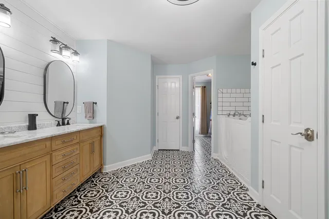 a bathroom with a sink and a mirror