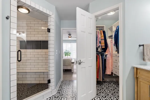 a bathroom with a sink and shower