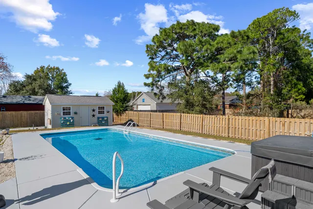 a view of a chairs and table in the patio