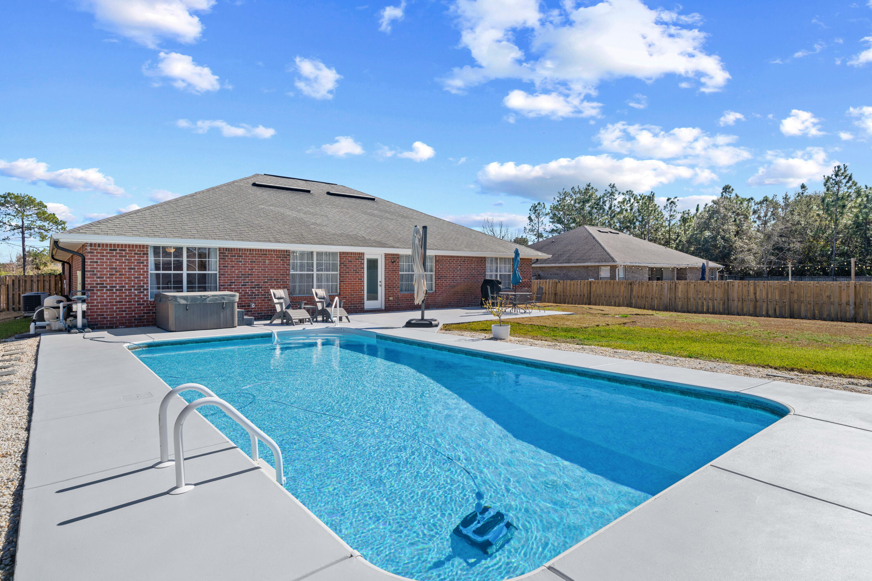 1933 Eagle Lane Navarre, FL 32566 - Photo 5 of 40 a view of a house with swimming pool