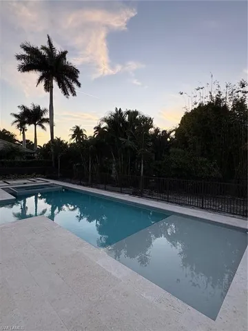 a view of swimming pool with a yard