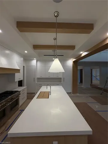 a large kitchen with stainless steel appliances