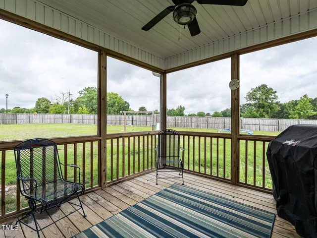 a view of balcony with wooden floor