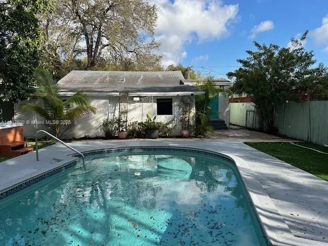 a view of a house with swimming pool